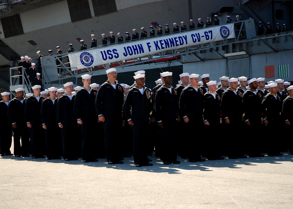 US Navy 070323-N-4565G-011 The Sailors of USS John F Kennedy (CV 67) disembark the ship near the end of the ship's decommissioning ceremony