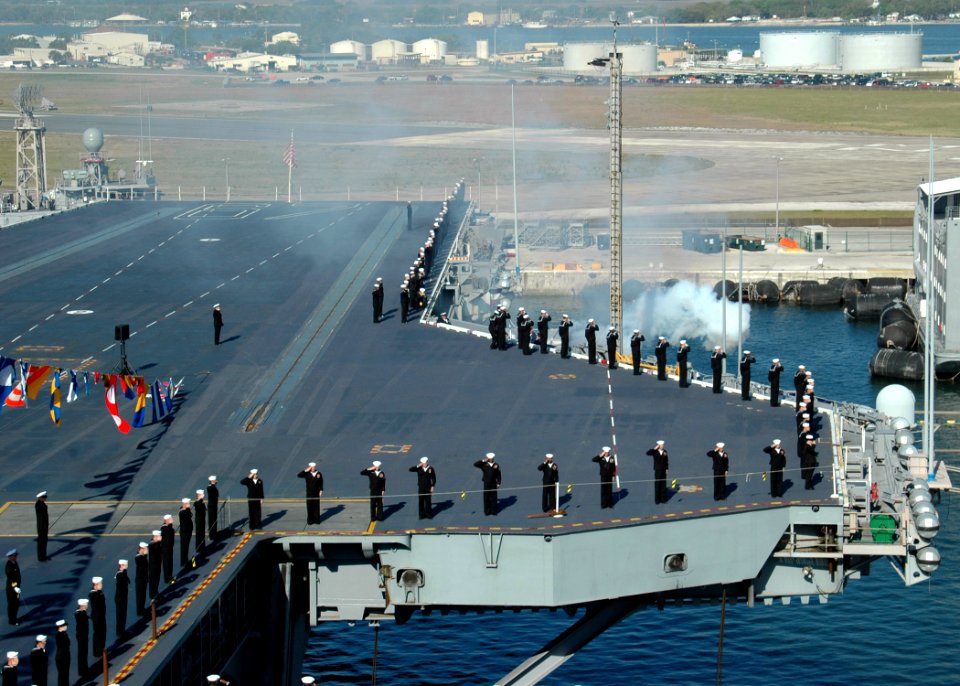 US Navy 070323-N-1522S-046 Sailors salute as a 19-gun salute is rendered during the decommissioning ceremony of USS John F. Kennedy (CV 67)