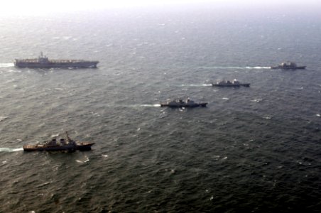 US Navy 070327-N-7130B-202 Nimitz-class aircraft carrier USS Ronald Reagan (CVN 76) maneuvers into position for a photo exercise (PHOTOEX) with the members of Ronald Reagan Strike Group and ships from the Republic of Korea