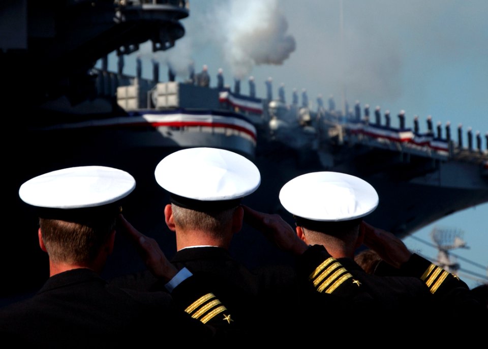 US Navy 070323-N-3285B-041 Officers render honors during a 19-gun salute at the decommissioning ceremony of USS John F. Kennedy (CV 67)