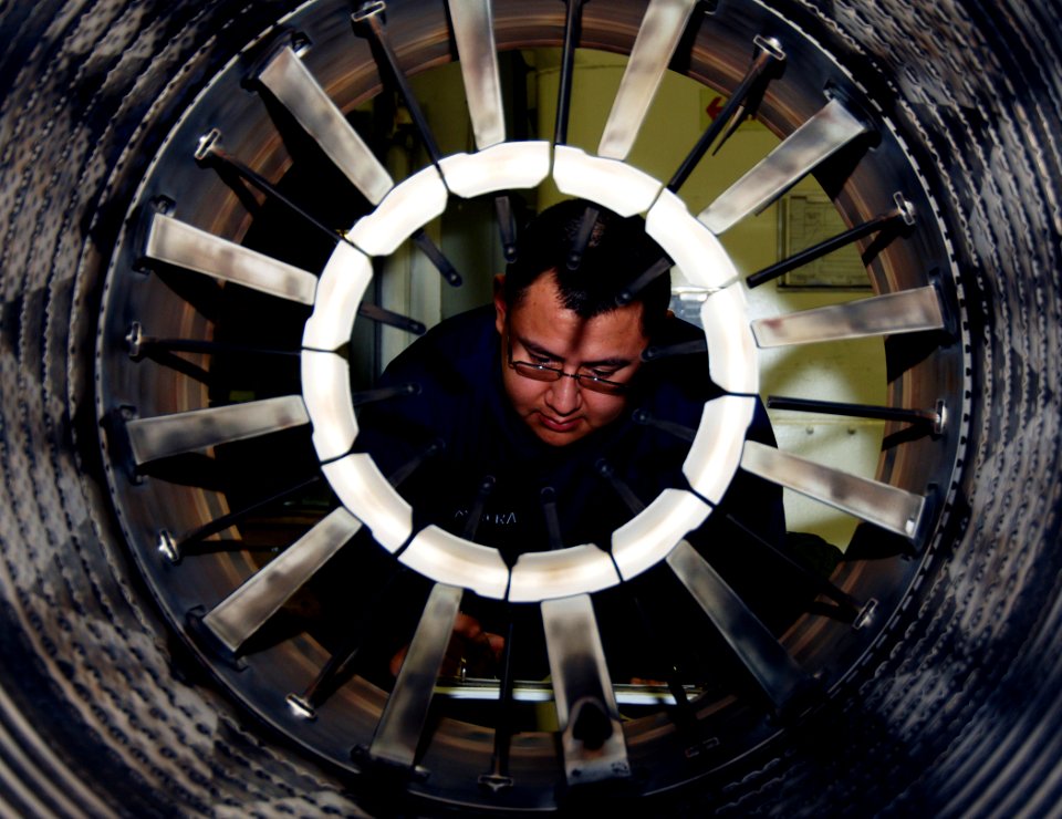 US Navy 070327-N-8923M-090 Aviation Machinist's Mate Airman Guillermo Cabrera accounts for inventory posted on a jet engine aboard the Nimitz-class aircraft carrier USS Harry S. Truman (CVN 75)