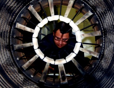 US Navy 070327-N-8923M-090 Aviation Machinist's Mate Airman Guillermo Cabrera accounts for inventory posted on a jet engine aboard the Nimitz-class aircraft carrier USS Harry S. Truman (CVN 75)