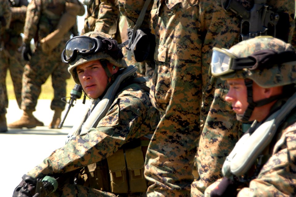 US Navy 070322-N-8539M-002 Lance Cpl. Jason Weiss, assigned to Marine Corps Security Force Company, Europe, takes a break after fast roping from a Spanish navy SH-3 Sea King helicopter