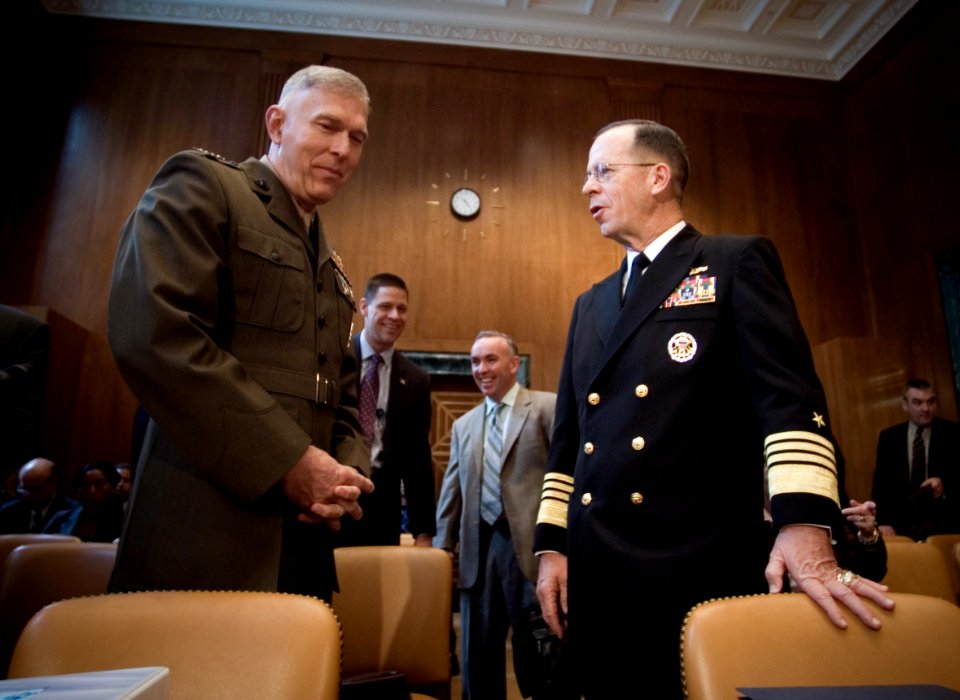 US Navy 070328-N-0696M-153 Chief of Naval Operations (CNO) Adm. Mike Mullen speaks with Commandant of the Marine Corps Gen. James T. Conway prior to testifying before the Senate Appropriations Committee on the 2008 National Def