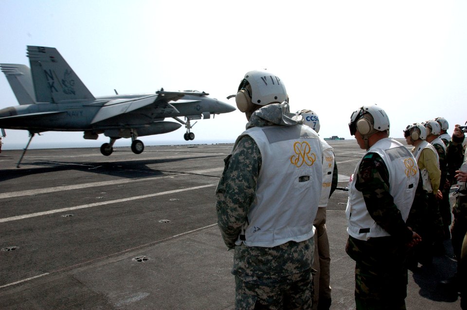 US Navy 070328-N-1635S-002 Commander United Nations Command, Combined Forces Command United States Forces Korea, Gen. B.B. Bell, left, watches the landing of an F-A-18E Super Hornet with a group of distinguished visitors (DV)