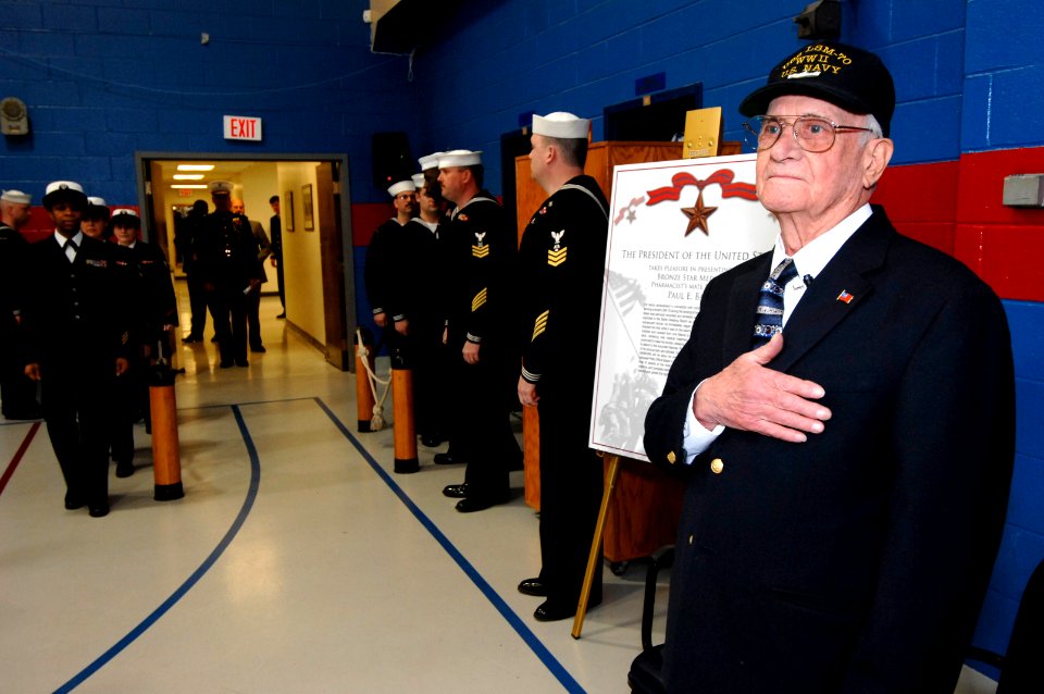 US Navy 070323-N-3642E-366 U.S. Navy veteran Paul E. Baker, renders honors during arrival of the Secretary of the Navy (SECNAV), the Honorable Dr. Donald C. Winter