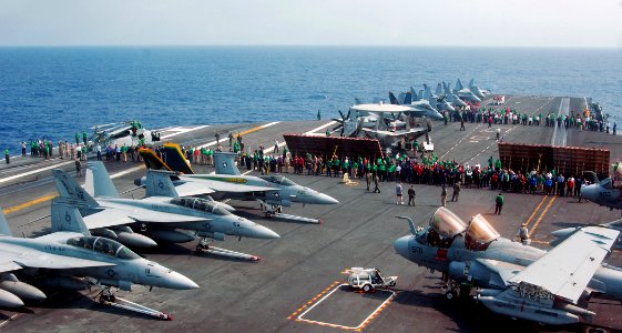 US Navy 070328-N-8923M-004 Sailors check for debris on the flight deck during a foreign object damage (FOD) walk down prior to flight operations on board Nimitz-class aircraft carrier USS Harry S. Truman (CVN 75)