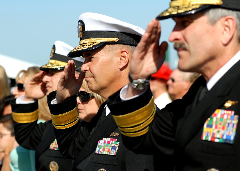 US Navy 070323-N-4565G-007 Navy Flag officers salute the color guard during the playing of the national anthem at the beginning of the USS John F. Kennedy (CV 67) decommissioning ceremony
