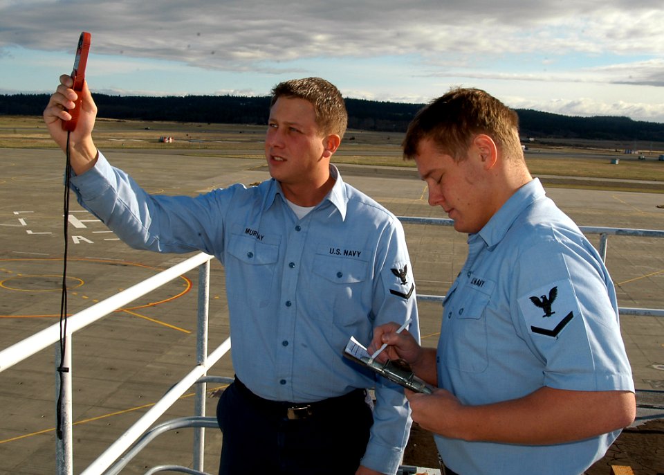 US Navy 070327-N-6247M-011 Aerographer's Mate 3rd Class Bryan Murray, and Aerographer's Mate 3rd Class Timothy Fleming take and record wind readings