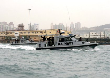 US Navy 070327-N-7027P-195 Units from Naval Coastal Warfare Squadron (NCWS) 33 conduct training operations in the port of Busan, during Exercise Reception, Staging, Onward movement, and Integration-Foal Eagle 2007 (RSO^I-FE 07) photo
