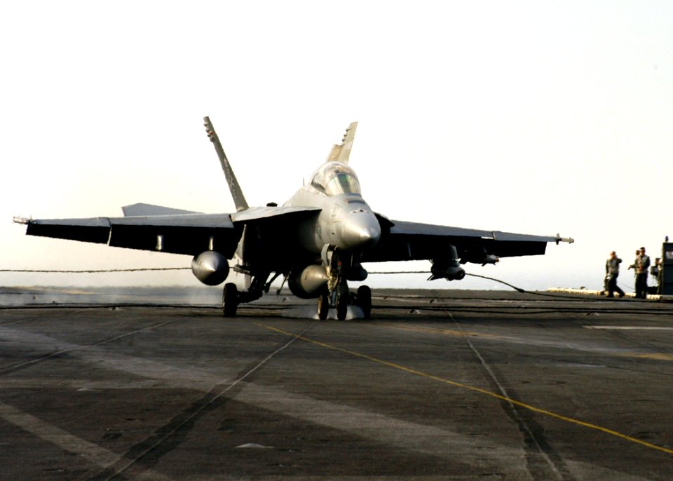US Navy 070327-N-8446A-005 An F-A-18F Super Hornet, assigned to the Jolly Rogers of Strike Fighter Squadron (VFA) 103, lands on the flight deck of Nimitz-class aircraft carrier USS Dwight D. Eisenhower (CVN 69)