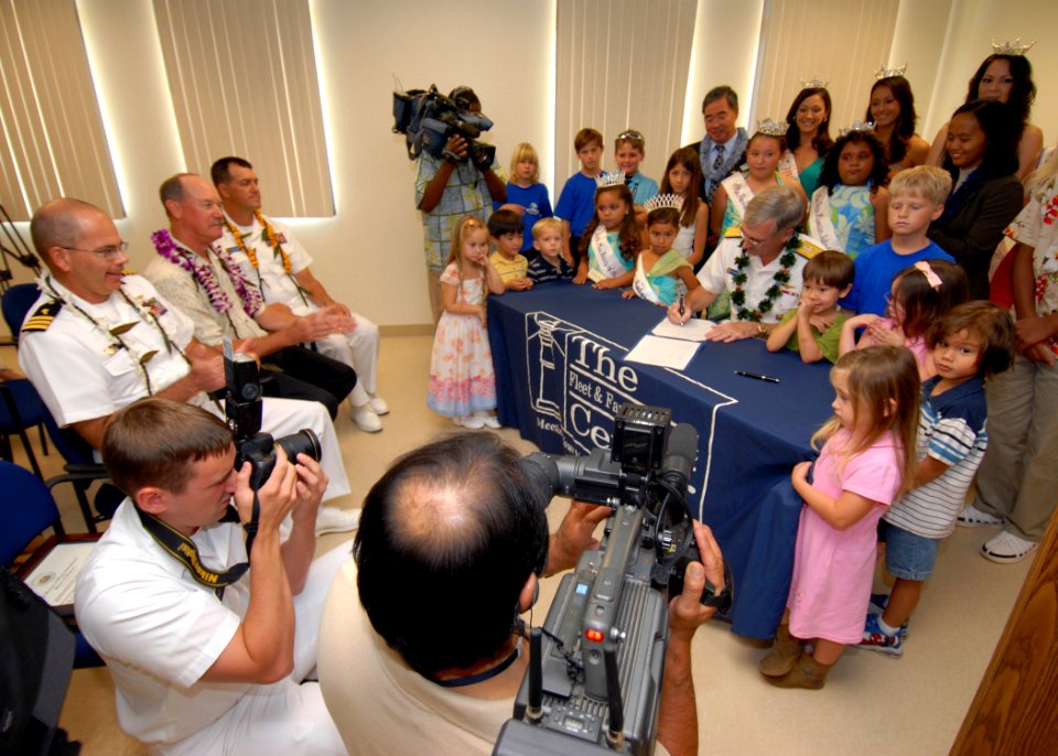 US Navy 070329-N-4965F-001 Commander, Navy Region Hawaii and Naval Surface Group Middle Pacific, Rear Adm. T. G. Alexander signs a Month of the Military Child and Child Abuse Prevention Month proclamation