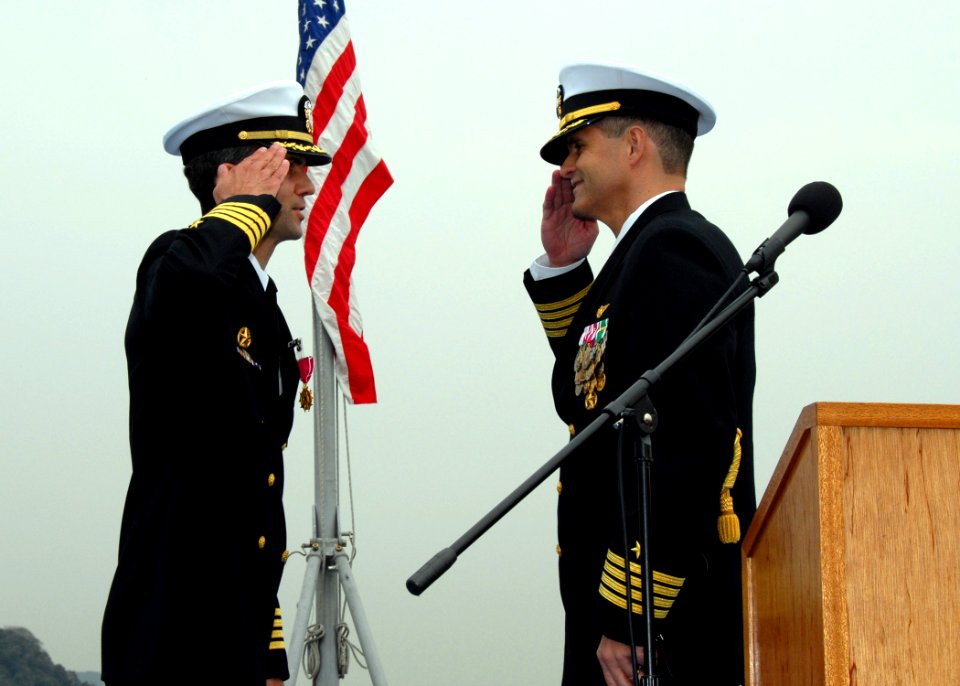 US Navy 070327-N-9860Y-173 Capt. David A. Lausman salutes as he relieves Capt. Jeff Bartkoski of command aboard amphibious command ship USS Blue Ridge (LCC 19) during a change of command ceremony