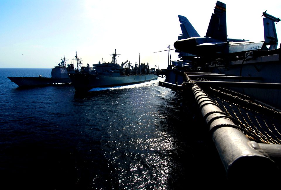 US Navy 070324-N-3729H-065 Guided missile cruiser USS Vella Gulf (CG 72) and USS John C. Stennis (CVN 74) transfer supplies and fuel from Military Sealift Command (MSC) fast combat support ship USNS Bridge (T-AOE 10) during a r