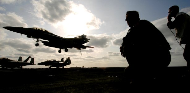 US Navy 070326-N-5345W-116 A landing signal officer (LSO) watches from the LSO platform as an F-A-18F Super Hornet, assigned to the Red Rippers of Strike Fighter Squadron (VFA) 11