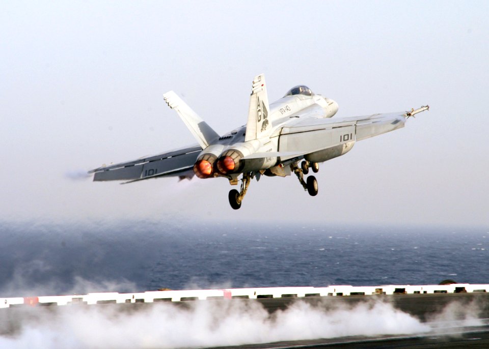 US Navy 070327-N-8446A-008 An F-A-18E Super Hornet, assigned to the Pukin Dogs of Strike Fighter Squadron (VFA) 143, makes an arrested landing on the flight deck of Nimitz-class aircraft carrier USS Dwight D. Eisenhower (CVN 69
