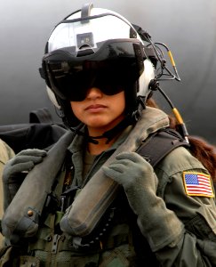 US Navy 070328-N-5345W-092 Aviation Warfare Systems Operator 2nd Class Rocio Britos, assigned to the Dusty Dogs of Helicopter Anti-Submarine Squadron (HS) 7, waits to board an SH-60 Seahawk on board Nimitz-class aircraft carrie