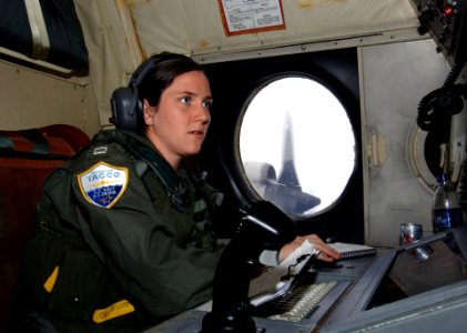 US Navy 070329-N-0260R-002 U.S. Navy Patrol Plane Tactical Coordinator and Mission Commander, Lt. Colleen Stephens of Patrol and Reconnaissance Squadron (VP) 4, monitors maritime contact data while on a flight over the coast of