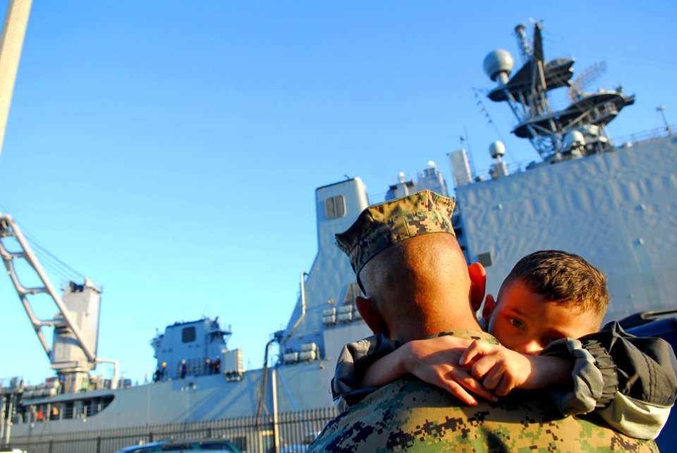 US Navy 070328-N-4776G-120 Gunnery Sgt. Octavio Gonzalez's son refuses to let go of his father's neck as he prepares to deploy with dock landing ship USS Pearl Harbor (LSD 52)