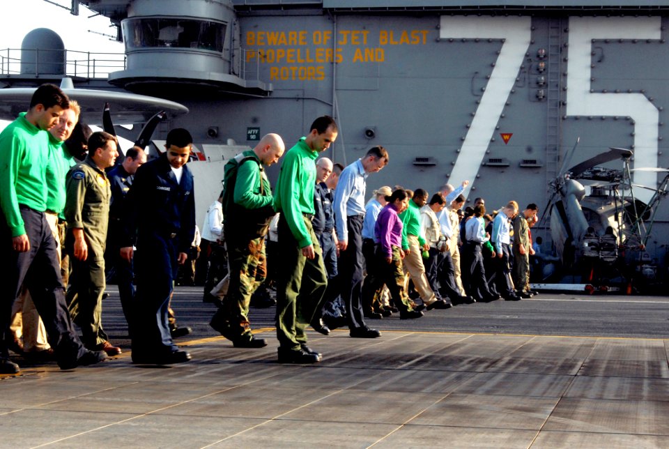 US Navy 070327-N-8923M-157 Sailors participate in a foreign object damage (FOD) walkdown aboard Nimitz-class aircraft carrier USS Harry S. Truman (CVN 75)