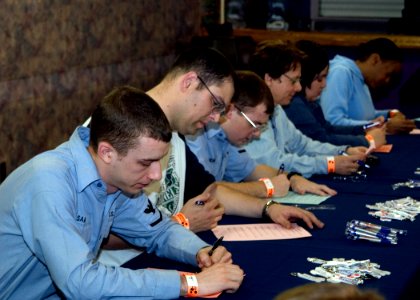 US Navy 070329-N-0483B-001 Sailors stationed on board Commander Fleet Activities Yokosuka take a pretest for a chance to appear on Jeopardy photo