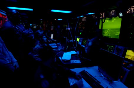 US Navy 070403-N-5345W-208 ailors observe and track flight operations in the Combat Direction Center (CDC) aboard the Nimitz-class aircraft carrier USS Harry S. Truman (CVN 75)
