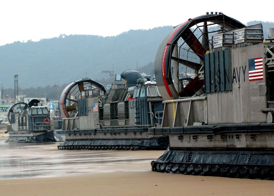 US Navy 070329-N-6710M-019 Landing Craft Air Cushions (LCAC) assigned to Beachmaster Unit (BMU) 5 WESTPAC prepare to onload equipment while on Republic of Korea shores in support of Foal Eagle 07