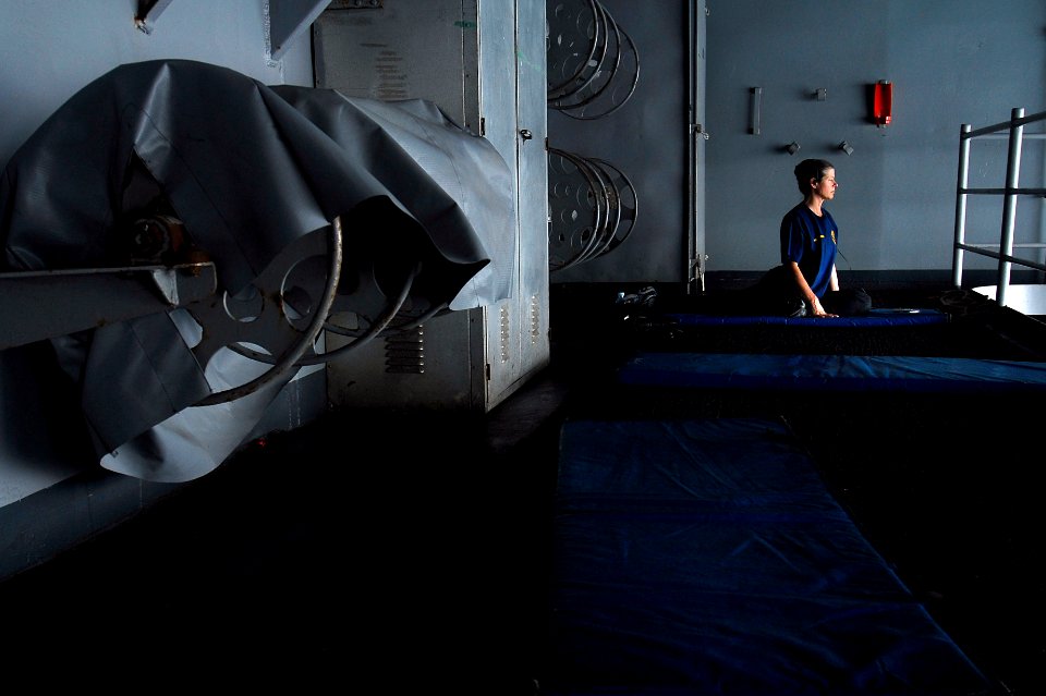 US Navy 070404-N-3729H-019 Senior Chief Information Systems Technician Cindi Chambliss performs yoga on the starboard boat deck to relax and stay fit aboard the Nimitz-class aircraft carrier USS John C. Stennis (CVN 74)