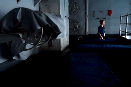 US Navy 070404-N-3729H-019 Senior Chief Information Systems Technician Cindi Chambliss performs yoga on the starboard boat deck to relax and stay fit aboard the Nimitz-class aircraft carrier USS John C. Stennis (CVN 74)