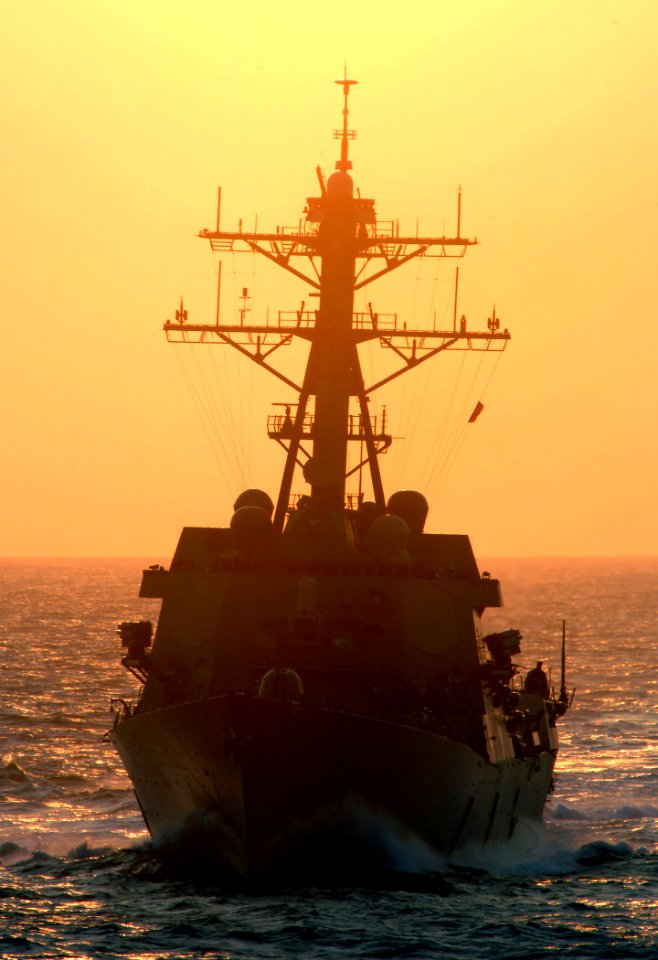 US Navy 070328-N-5345W-001 Arleigh Burke-class guided missile destroyer USS Oscar Austin (DDG 79) approaches from aft of Nimitz-class aircraft carrier USS Harry S. Truman (CVN 75) during preparations for an early morning refuel