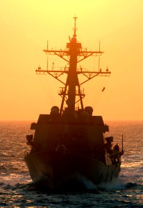 US Navy 070328-N-5345W-001 Arleigh Burke-class guided missile destroyer USS Oscar Austin (DDG 79) approaches from aft of Nimitz-class aircraft carrier USS Harry S. Truman (CVN 75) during preparations for an early morning refuel