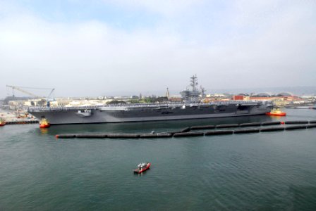 US Navy 070402-N-6326B-011 Sailors man the rails on the flight deck aboard nuclear-powered aircraft carrier USS Nimitz (CVN 68)
