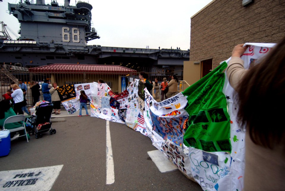 US Navy 070402-N-8273J-035 Members of Team Nimitz display personalized pillowcases for departing Sailors and Marines embarked aboard the nuclear-powered aircraft carrier USS Nimitz (CVN 68)