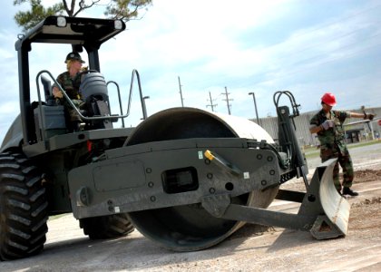 US Navy 070405-N-1325M-073 Seabees assigned to Naval Mobile Construction Battalion (NMCB) 24, and Naval Mobile Construction Battalion (NMCB) 27 grade an area during a rapid runway repair class