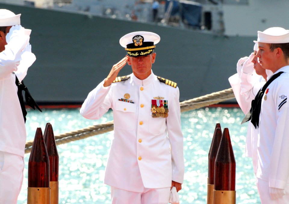 US Navy 070405-N-4965F-020 Commander Destroyer Squadron (DESRON) 31, Capt. R. Bruce Stewart, is piped through the side boys at the conclusion of a change of command ceremony