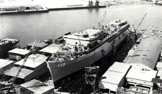 USS Emory S. Land (AS-39) under construction at Lockheed Shipbuilding, Seattle, Washington (USA), in 1977 photo