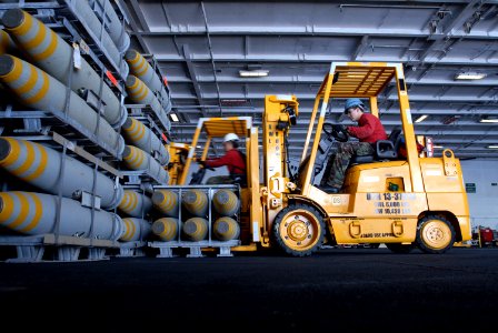 US Navy 070405-N-7730P-163 Aviation ordnanceman fill the hangar bay of Nimitz-class aircraft carrier USS Ronald Reagan (CVN 76) with ammunition and ordnance to prepare for ammunition offload