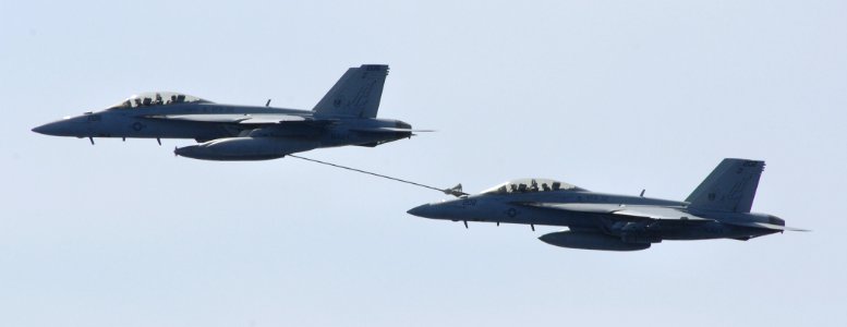 US Navy 070403-N-5345W-121 Two F-A-18F Super Hornet from the Swordsmen of Strike Fighter Squadron (VFA) 32 perform a high-speed low-altitude fuel transfer