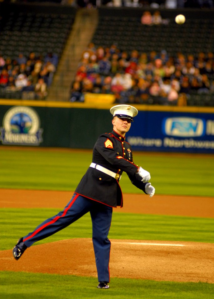 US Navy 070403-N-7981E-121 Marine Aviation Training Support Group (MATSG) 53 Marine of the Year Sgt. James Palmer throws out the ceremonial first pitch at the 5th Annual Salute to the Armed Forces Night at Safeco Field in Seatt