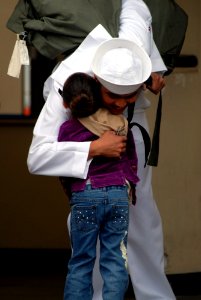 US Navy 070402-N-8273J-115 Fireman David Zavaleta says last-minute goodbyes to family members prior to boarding nuclear-powered aircraft carrier USS Nimitz (CVN 68)
