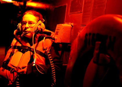 US Navy 070406-N-4953E-009 Seaman Jessica Koehne stands watch as the boat deck phone talker during an underway replenishment with the Royal Australian auxiliary oiler replenishment (AOR) vessel HMAS Success