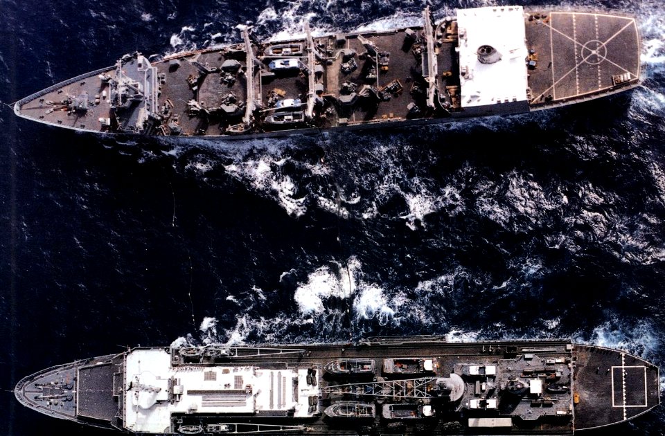 USS Emory S. Land (AS-39) refuels from a Wichita-class replenishment oiler, in 1988