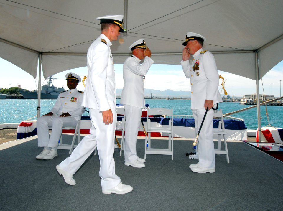 US Navy 070405-N-4965F-017 Capt. Fredrick W. Pfirrmann salutes Commander Naval Surface Group Middle Pacific, Commander Navy Region Hawaii, Rear Adm. T.G. Alexander, as he turns over command of Destroyer Squadron (DESRON) 31