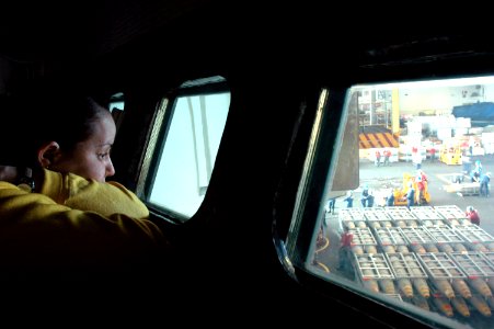 US Navy 070406-N-1635S-006 Watching through a window in conflagrigation station three aboard USS Ronald Reagan (CVN 76), Aviation Boatswain's Mate 3rd Class Erika Velez, from Puerto Rico, stands a three-hour watch during an ord