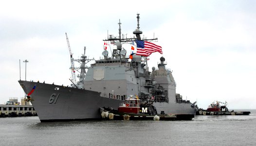 US Navy 070404-N-1713L-005 Tugboats escort the Ticonderoga-class cruiser USS Monterey (CG 61) to the pier