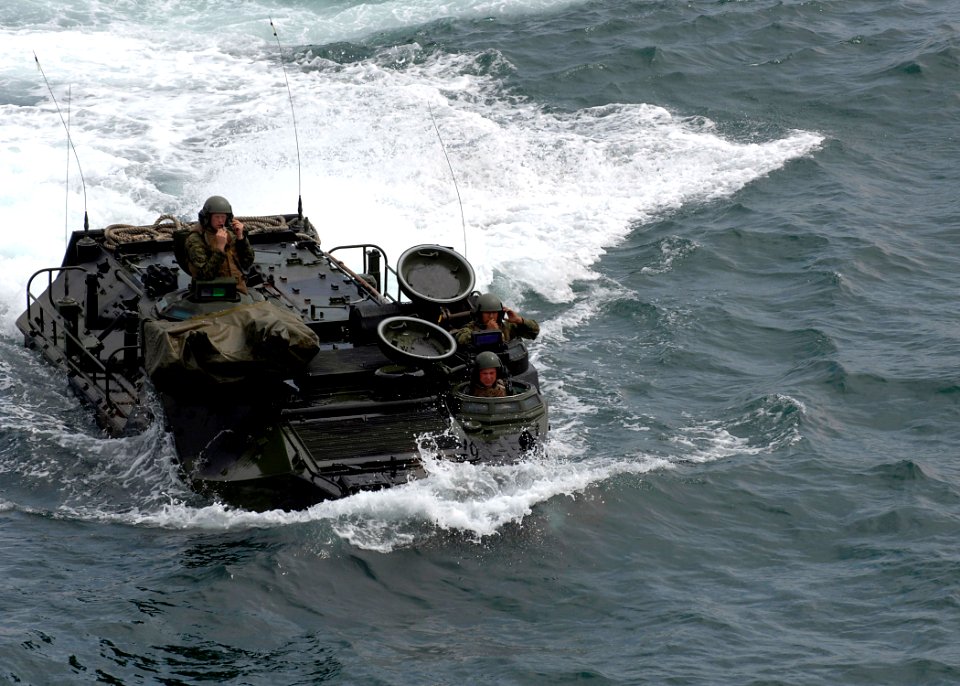 US Navy 070404-N-4954I-060 U.S. marines assigned to the 3rd Amphibious Assault Battalion (3rd AAB), prepare to enter the well deck of the amphibious assault ship USS Peleliu (LHA 5)