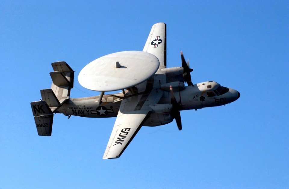 US Navy 070403-N-9712C-178 An E-2C Hawkeye, from the Black Eagles of Airborne Early Warning Squadron (VAW) 113, performs a flyby over the flight deck of USS Ronald Reagan (CVN 76)