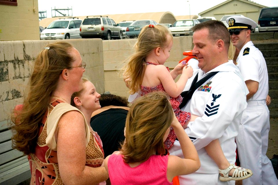 US Navy 070407-N-4856G-004 Personnel Specialist 1st Class George Nonicker assigned to the guided missile destroyer USS Russell (DDG 59) greets his family as the ship returns to Naval Station Pearl Harbor