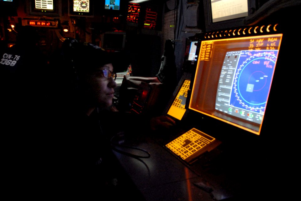 US Navy 070406-N-4133B-090 Operations Specialist 3rd Class Nichole Kelley from West St. Paul, Minn., stands Q-70 surface tracer watch in the ship's tactical operations plotting (TOP)