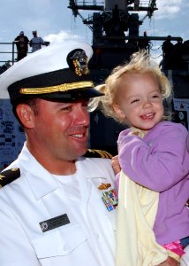 US Navy 070405-N-1810F-141 USS Robert G. Bradley (FFG 49) Executive Officer Lt. Cmdr. Peter R. Berning embraces his daughter on her 3rd birthday, which happened to coincide with the ship's homecoming